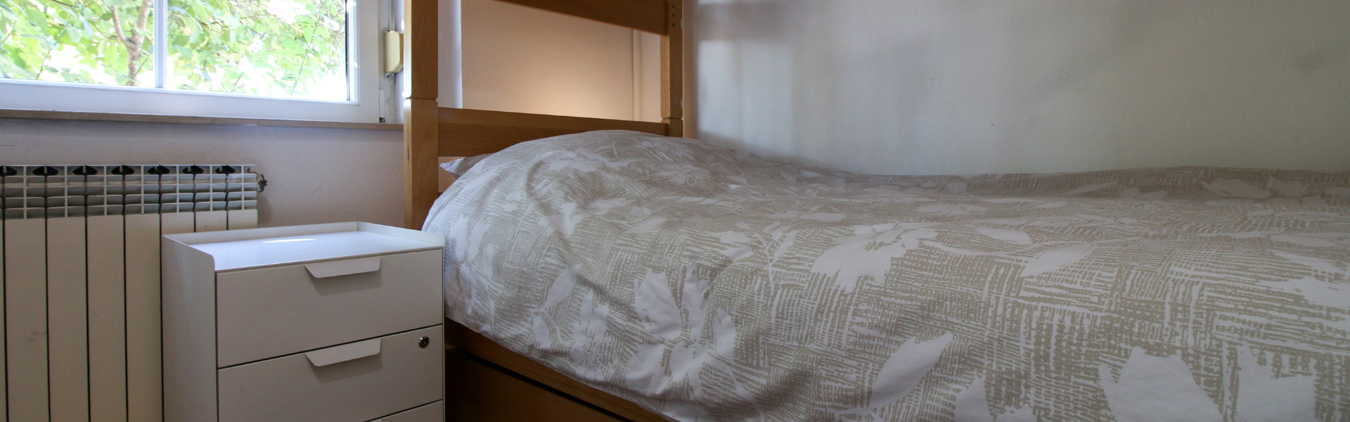 The image shows the bedroom of Room Ravnice Two A1.