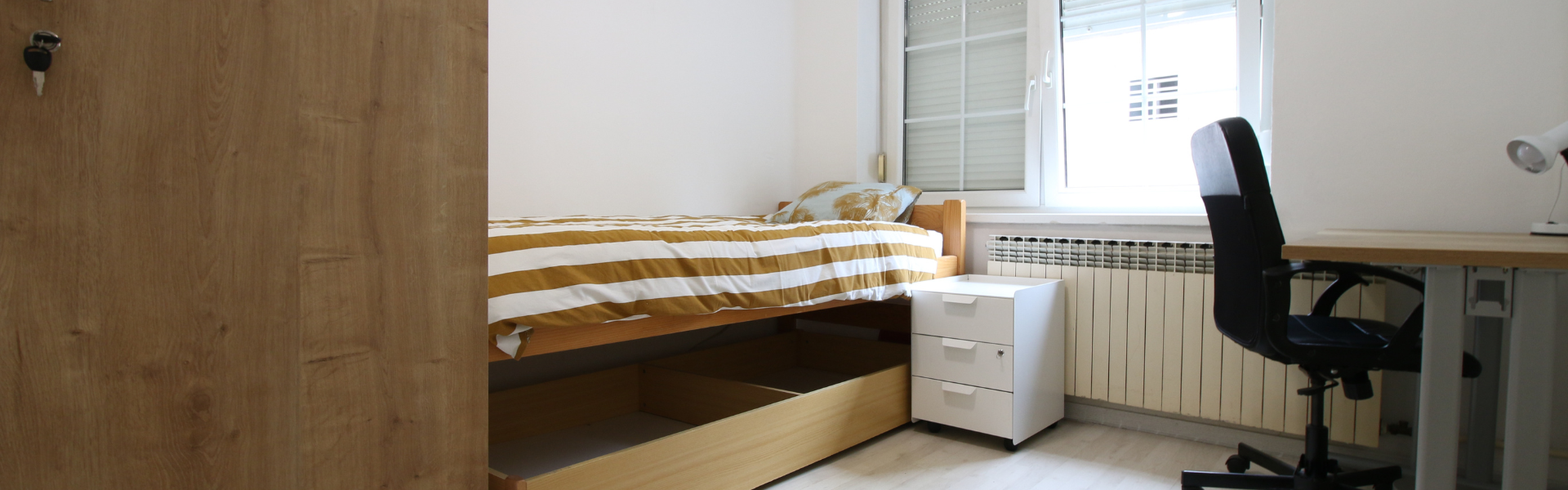 The image shows the bedroom of Room Ravnice Two A2.