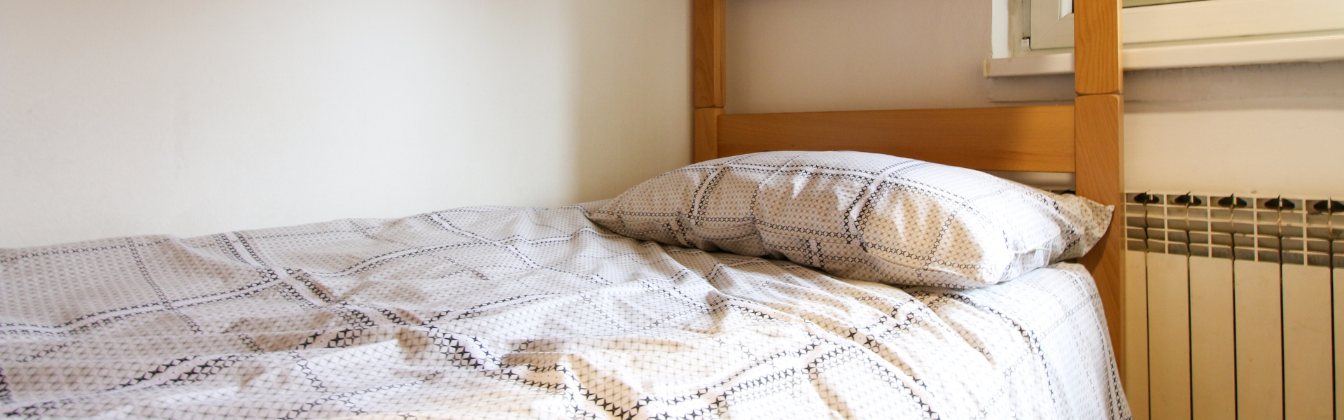 The image shows the bedroom of Room Ravnice Two A4.