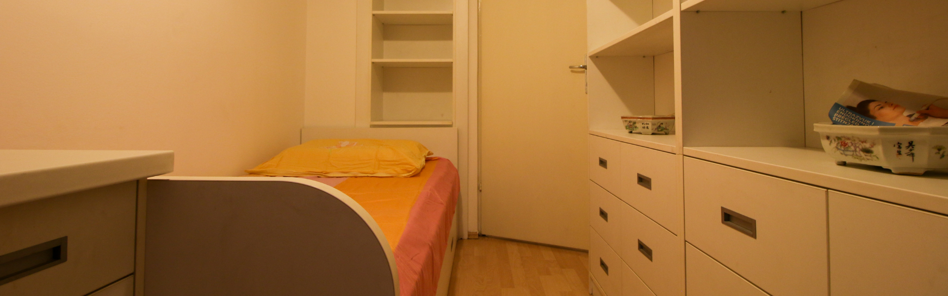 The image shows a bedroom in Room Dugave One.